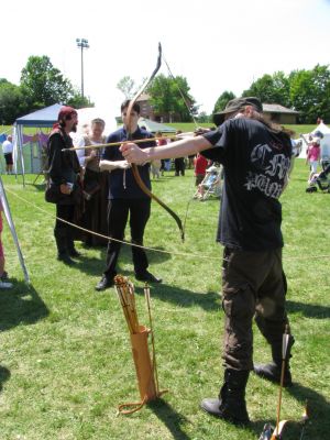 2(Sun) Pirate Fest - Archery - Rich
Rich lines up a shot while Snake watches from a safe distance.
Keywords: gathering10